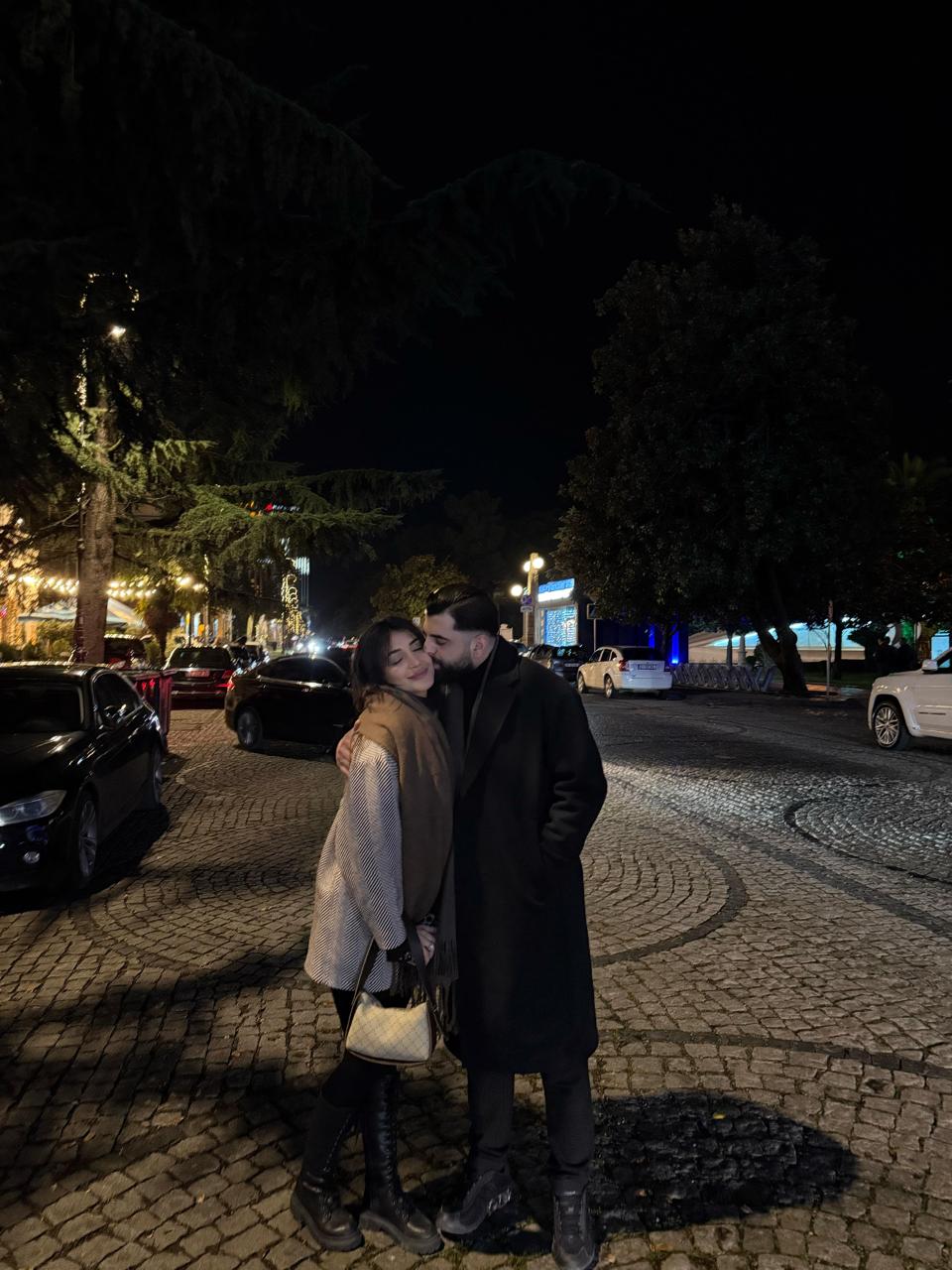 Murat & Nehir sharing a tender moment on a cobblestone street